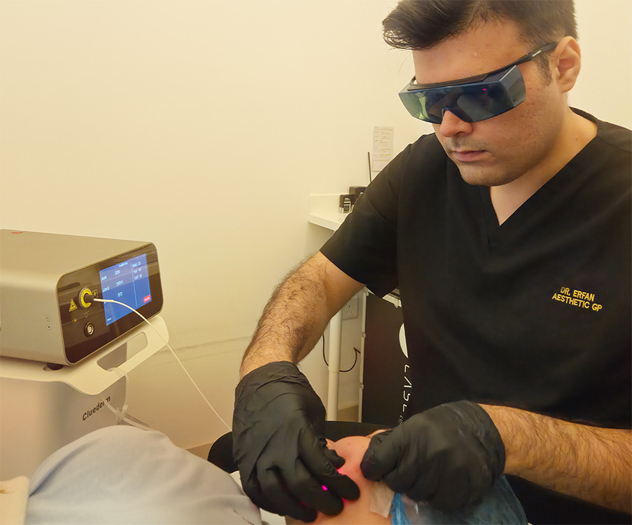 Patient receiving double chin treatment consultation at Queens Elite Medical