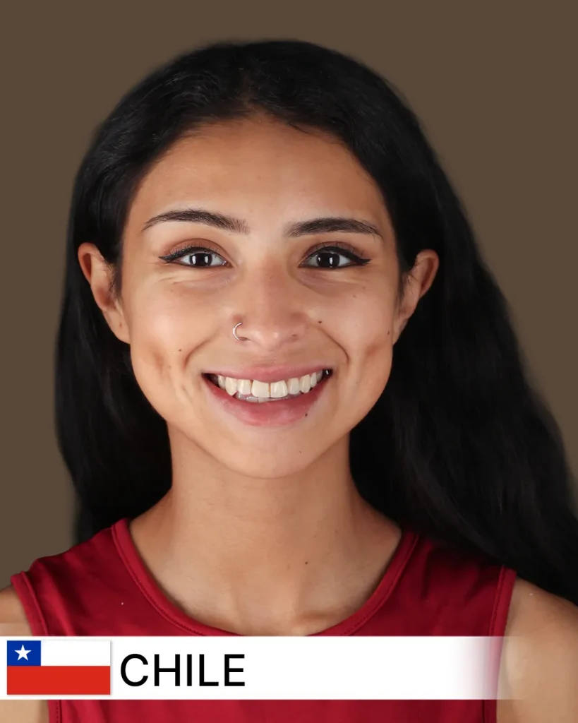 Smiling Chilean patient after a smile makeover, showing bright, perfectly aligned teeth.