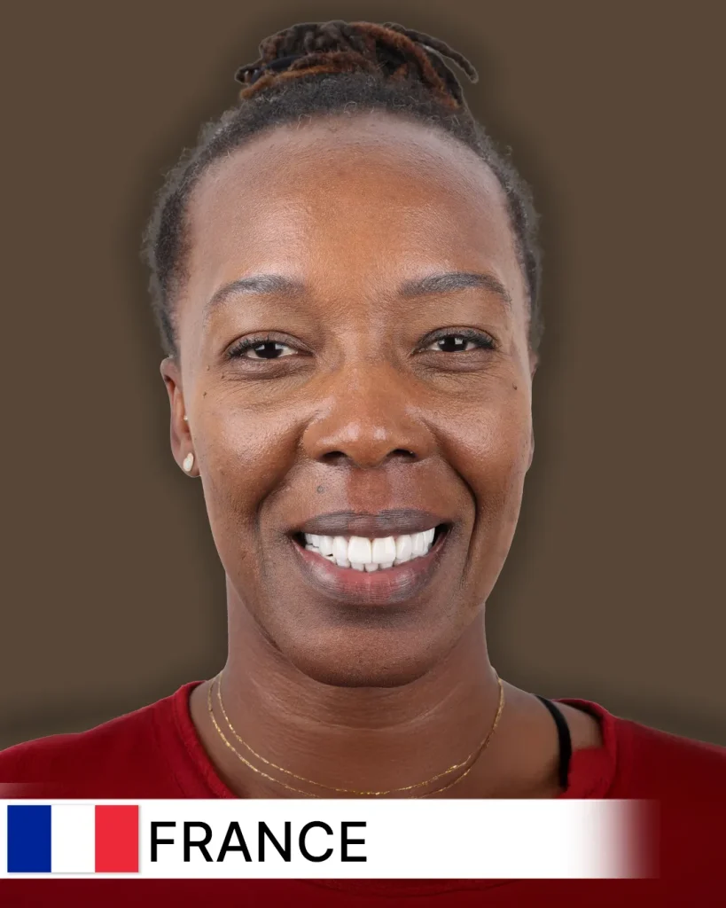 Close-up of a smiling patient, likely an adult, proudly displaying noticeably whiter, straighter, and beautifully aligned teeth after a successful smile makeover. The background is softly blurred, suggesting a contemporary dental clinic in France.